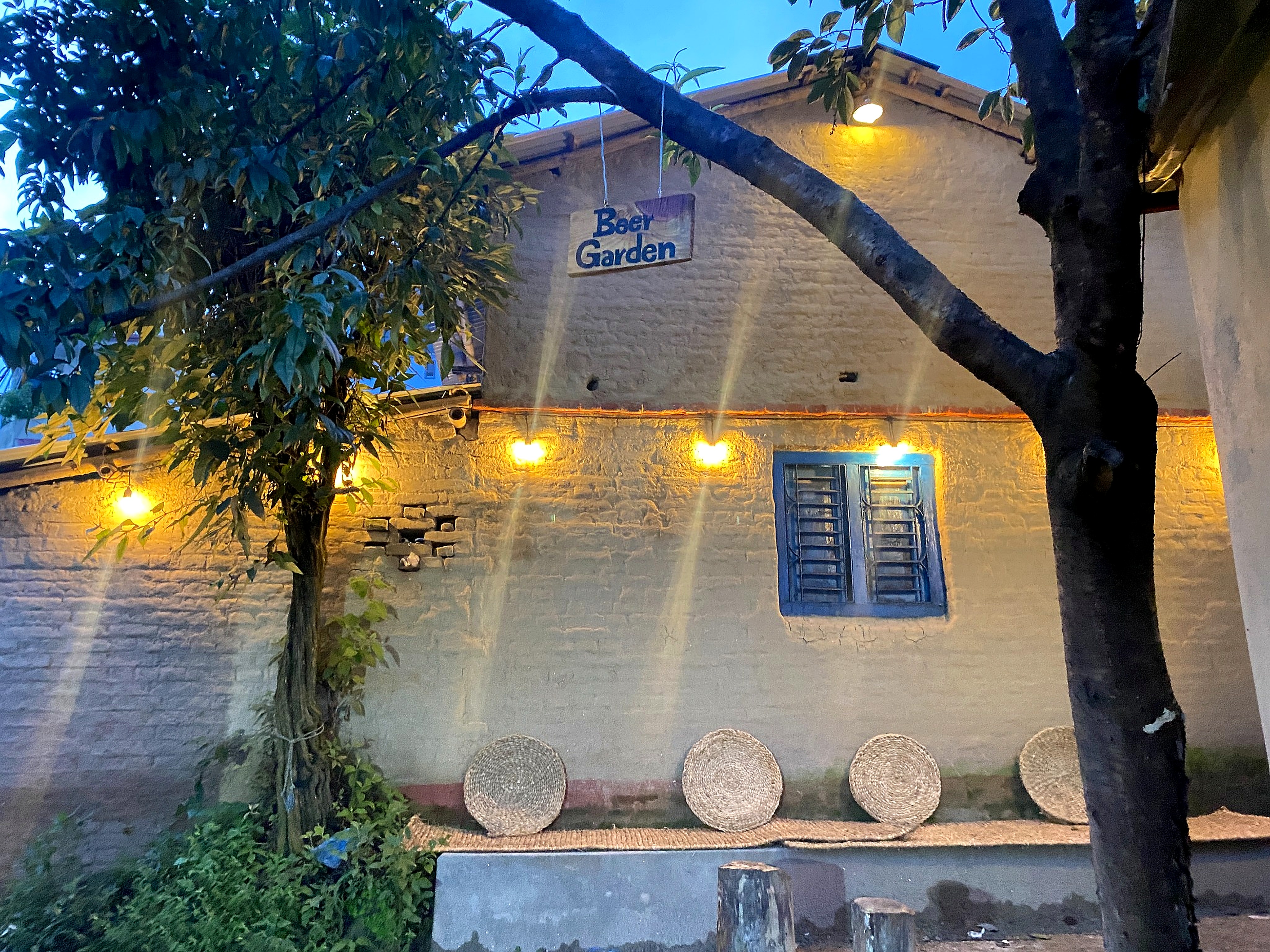 Warmly lit traditional Purano Ghar courtyard